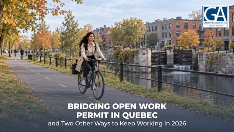 Woman cycling to work along the Lachine Canal bike path in Montreal on an autumn morning, with the old canal lock and converted brick lofts behind